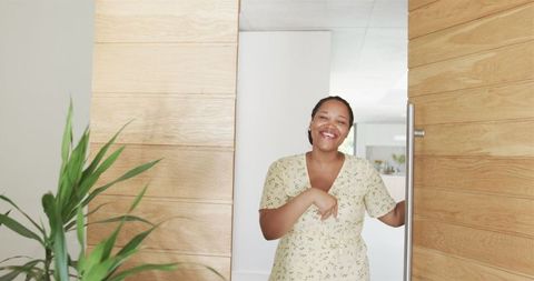Smiling Woman Entering Modern Bright Home Interior Decor