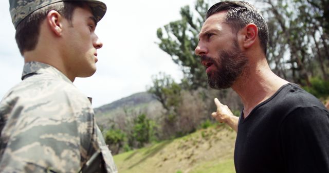 Intense Discussion Between Military Officer and Civilian in Forest - Download Free Stock Images Pikwizard.com