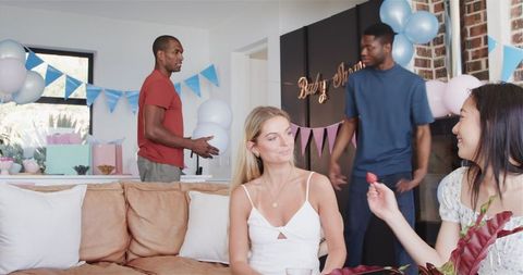 Diverse Friends Decorating for a Lively Baby Shower Celebration