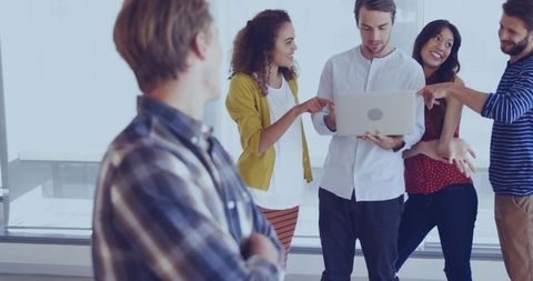 Team collaboration and idea sharing in modern office space