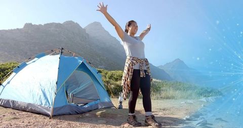 Hiker Enjoying Fresh Air at Mountain Campsite in Natural Setting