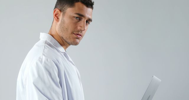 Young Medical Professional Using Laptop for Digital Healthcare - Download Free Stock Images Pikwizard.com