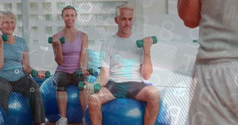 Seniors Exercising with Dumbbells in Fitness Studio