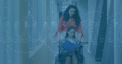 Caregiver assisting patient in wheelchair with documents