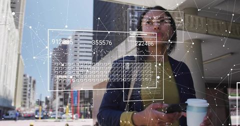 Confident Businesswoman Using Smartphone with Digital Data Overlay