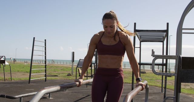 Athletic Woman Exercising on Outdoor Gym Equipment Near Beach - Download Free Stock Images Pikwizard.com