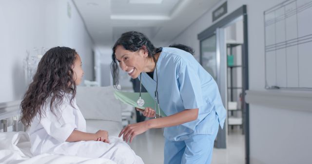 Friendly Nurse Playing with Child Patient in Hospital Corridor - Download Free Stock Images Pikwizard.com