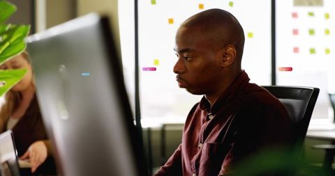 Focused professional collaborating in modern office environment