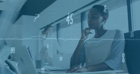 African American Businesswoman Analyzing Economic Data in Office