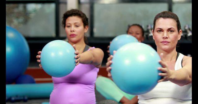 Pregnant Women Participating in Fitness Ball Exercise Class - Download Free Stock Images Pikwizard.com