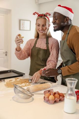 Diverse Couple Baking Holiday Cookies in Cozy Kitchen
