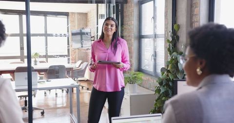 Professional businesswoman leading presentation in modern office
