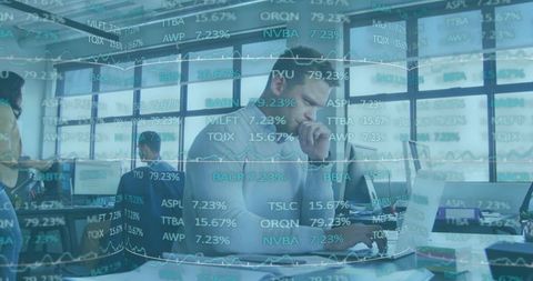 Man Analyzing Data in Dynamic Financial Workspace