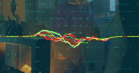 Industrial data visualization overlaying neon waveform over worker silhouette in workshop