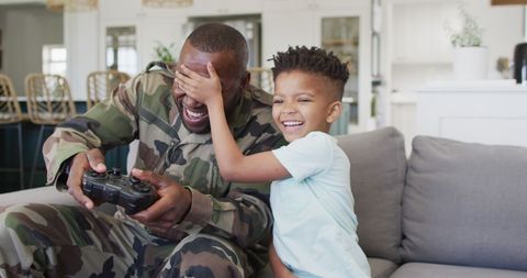 Father and Son Bonding Through Video Games at Home