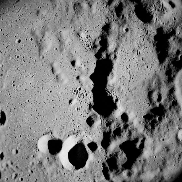 Apollo 8,Farside of Moon. Image taken on Revolution 4. Camera Tilt Mode: Vertical Stereo. Sun Angle: 13. Original Film Magazine was labeled D. Camera Data: 70mm Hasselblad. Lens: 80mm; F-Stop: F/2.8; Shutter Speed: 1/250 second. Film Type: Kodak SO-3400 Black and White,ASA 40. Flight Date: December 21-27,1968. 