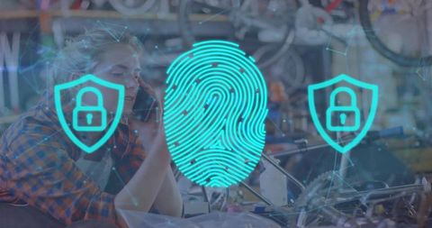 Bike mechanic on phone in repair workshop with biometric fingerprint security overlay