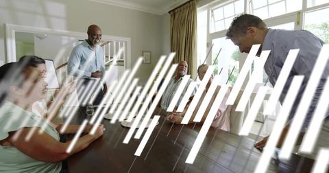 Multigenerational family chatting around sunlit dining table in contemporary home interior