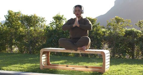 Tranquil Meditation Outdoors Listening to Music for Inner Peace