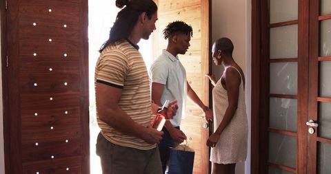 Warm Welcome: Friends Gathering at Home Doorway