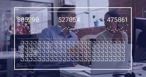 Collaborating colleagues analyzing data on laptop with futuristic hud overlay in office
