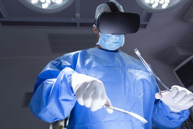Surgeon wearing virtual reality headset practicing surgery in an operation room. Ideal for content about advancements in medical technology, healthcare education, professional training, and innovative medical practices.
