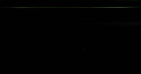 Vibrant Green Light Streak on Black Background