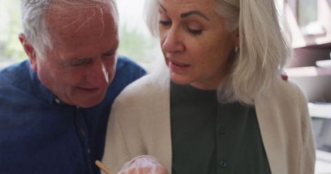 Elderly Couple Enjoying Cozy Kitchen Moment