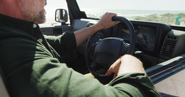 Man Driving Car along Scenic Coastal Road with Ocean View - Download Free Stock Images Pikwizard.com