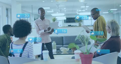 Diverse Team Engaged in Digital Strategy Meeting with Social Media Metrics