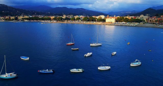 Scenic Bay with Boats on Calm Blue Water against Mountain Backdrop - Download Free Stock Images Pikwizard.com