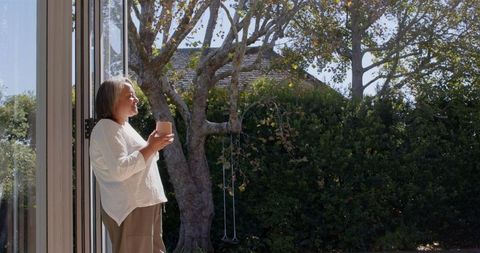 Senior Woman Enjoying Morning Coffee Outdoors