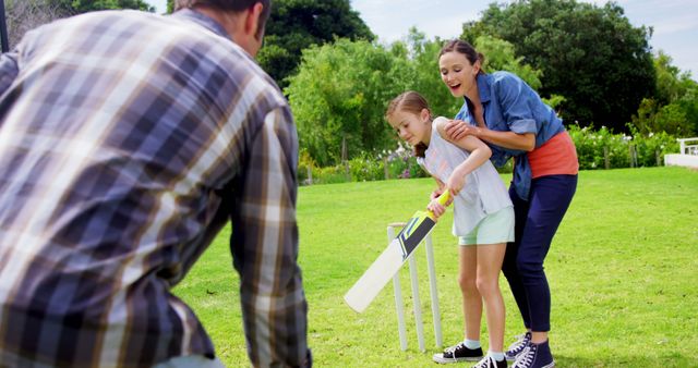 Family Enjoying Outdoor Cricket Game in Sunny Park - Download Free Stock Images Pikwizard.com