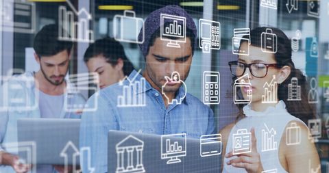 Coworkers Analyzing Data on Laptop with Technology Overlay