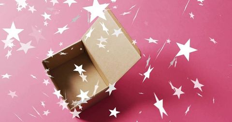 Open kraft cardboard box with falling white star confetti on pink pastel background