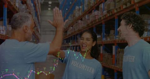 Multicultural Volunteers High-Fiving in Warehouse Setting - Download Free Stock Images Pikwizard.com