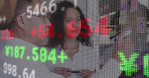 Diverse Business Colleagues Discussing Financial Data on Digital Interface