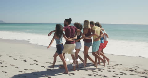 Diverse Group of Friends Enjoying Beach Together