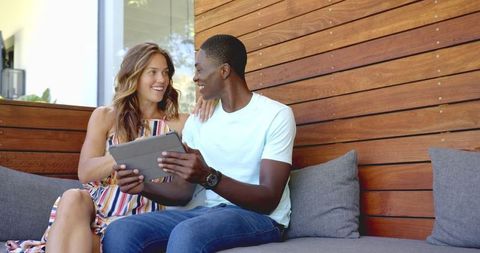 Smiling Couple Using Tablet Indoors on Cozy Couch - Download Free Stock Images Pikwizard.com