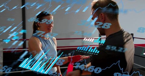 Trainer wrapping boxer hands with augmented reality performance analytics overlay in gym