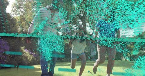 Family running through sunlit park with turquoise digital glitch effect and motion blur