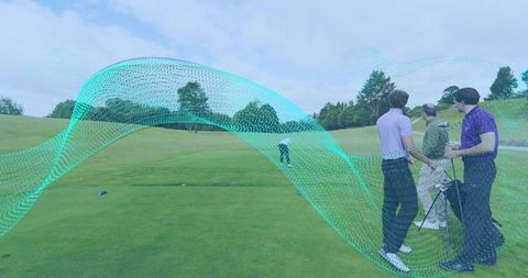 Golfers watching teal digital wave overlay on fairway holding clubs