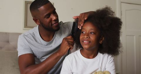 Father Gently Brushing Daughter's Hair in Bright Home - Download Free Stock Images Pikwizard.com