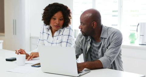 Focused Professionals Collaborating on Laptop Project - Download Free Stock Images Pikwizard.com