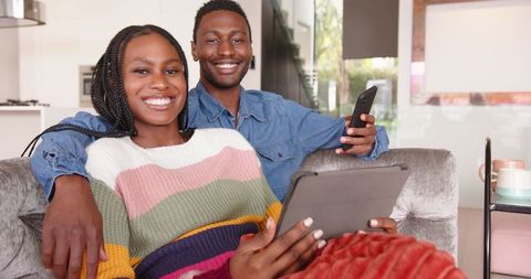 Couple Relaxing at Home with Technology