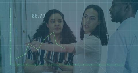 Business analysts collaborating with data and technology in corporate workspace