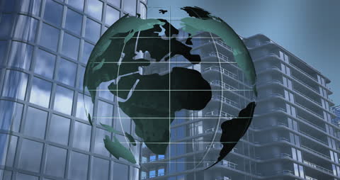 Digital Business Concept with Spinning Globe Over Modern Buildings