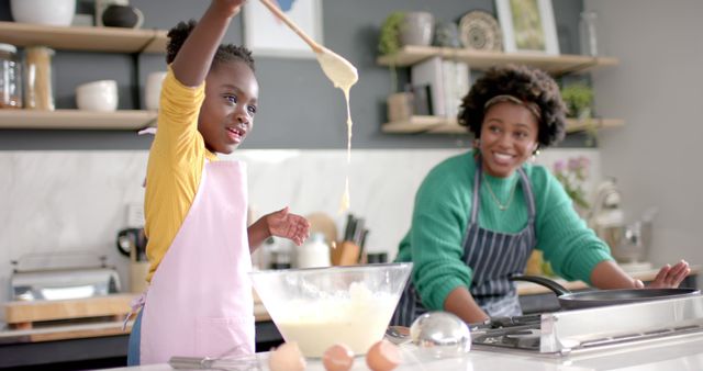 Smiling Mother and Daughter Baking Together in Modern Kitchen - Download Free Stock Images Pikwizard.com