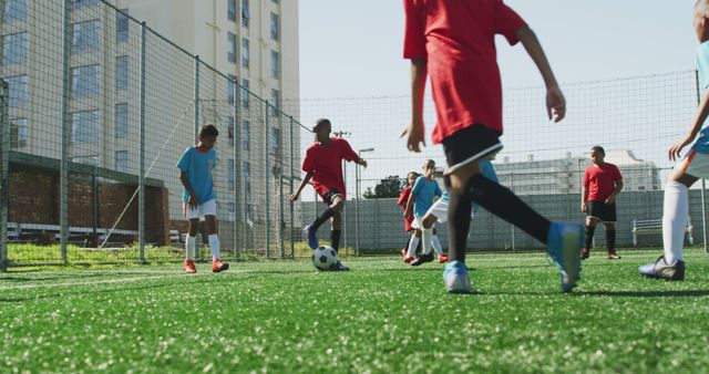 Kids Playing Soccer on Artificial Turf in Sunny Outdoor Field - Download Free Stock Images Pikwizard.com