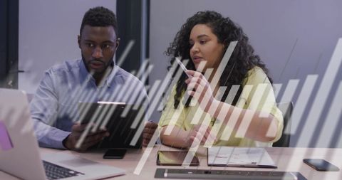 Diverse colleagues collaborating with digital analytics overlay